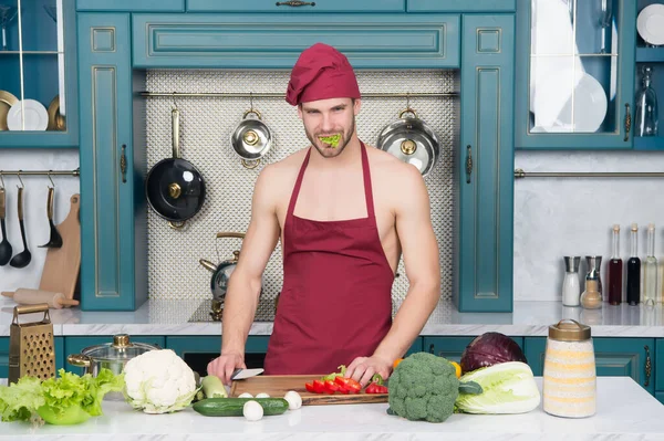Cooking healthy and tasty food. Easy recipes. Vegetarian taste better. Cooking flavors of nature. Bearded man enjoy cooking natural food. Sexy attractive naked chef cook prepare veggies for cooking — Stock Photo, Image