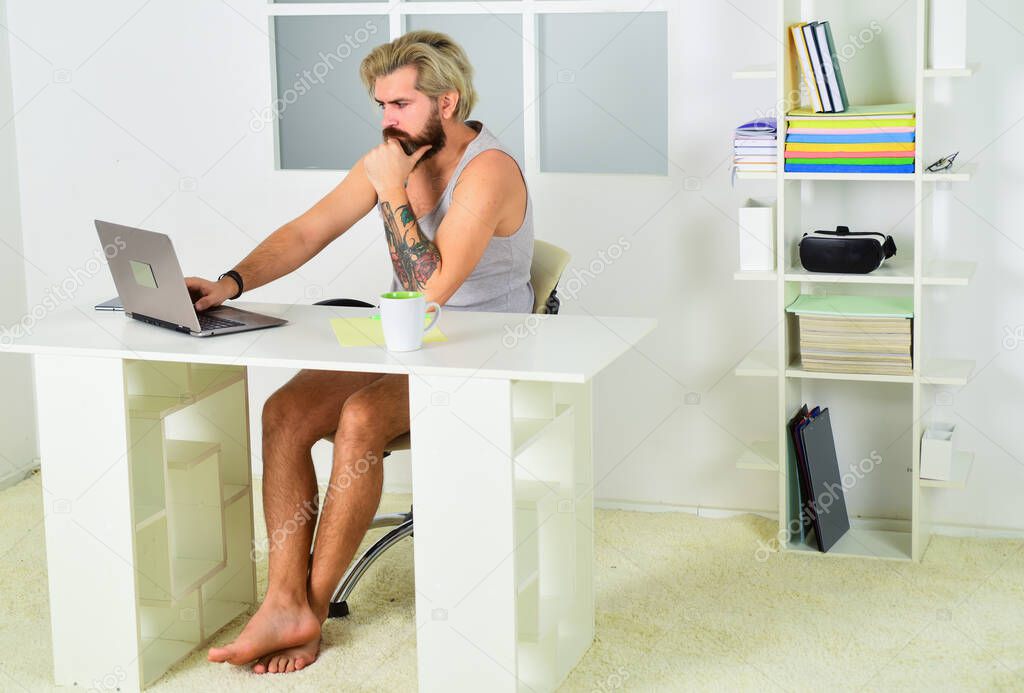 Responding on business e-mail. man programming on laptop. self-employed man solve business issues contact with client distantly. man in home office. mature businessman drink coffee is using computer