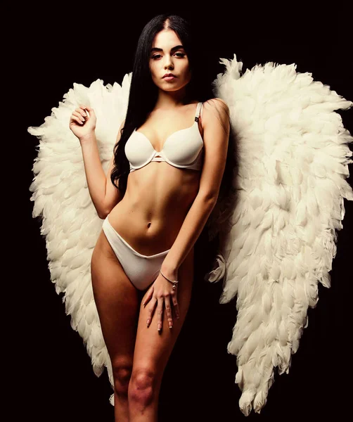 Forgive all sins. Attractive sensual woman angel wings. Innocent pure girl. Erotic show. Femininity and sensuality. Angel feather wings accessory. Provoke sexual desire. Impeccable body. Fallen angel — Stock Photo, Image