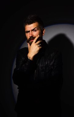 Man with beard on black background. Guy with thoughtful face