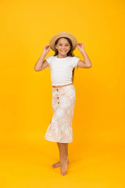 Happy childrens day. kid summer fashion. she is ready for beach party. finally summer holiday. small girl beauty. child wear straw hat. cheerful little girl on yellow background — Stock Photo, Image