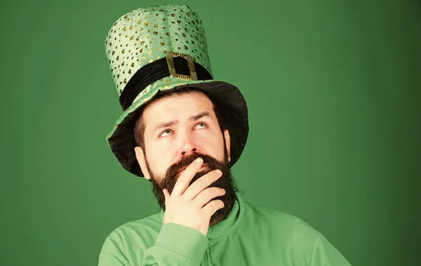 Saint patricks day holiday. Green part of celebration. Happy patricks day. Global celebration. St patricks day holiday known for parades shamrocks and all things Irish. Man bearded hipster wear hat