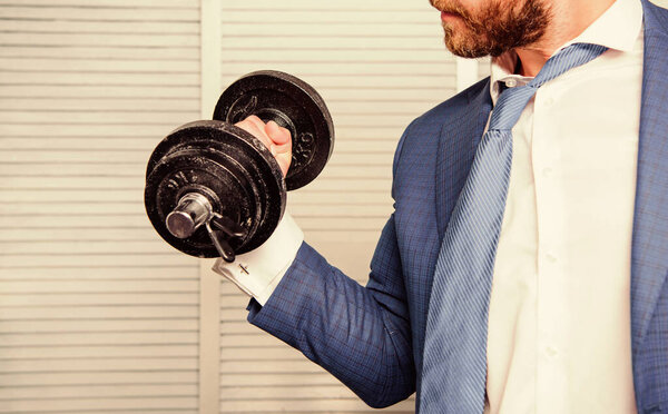 Business coach. Strong powerful business strategy. Efforts always rewarding. Put more effort. Man raise heavy dumbbell. Boss businessman manager raise hand with dumbbell close up. Successful business