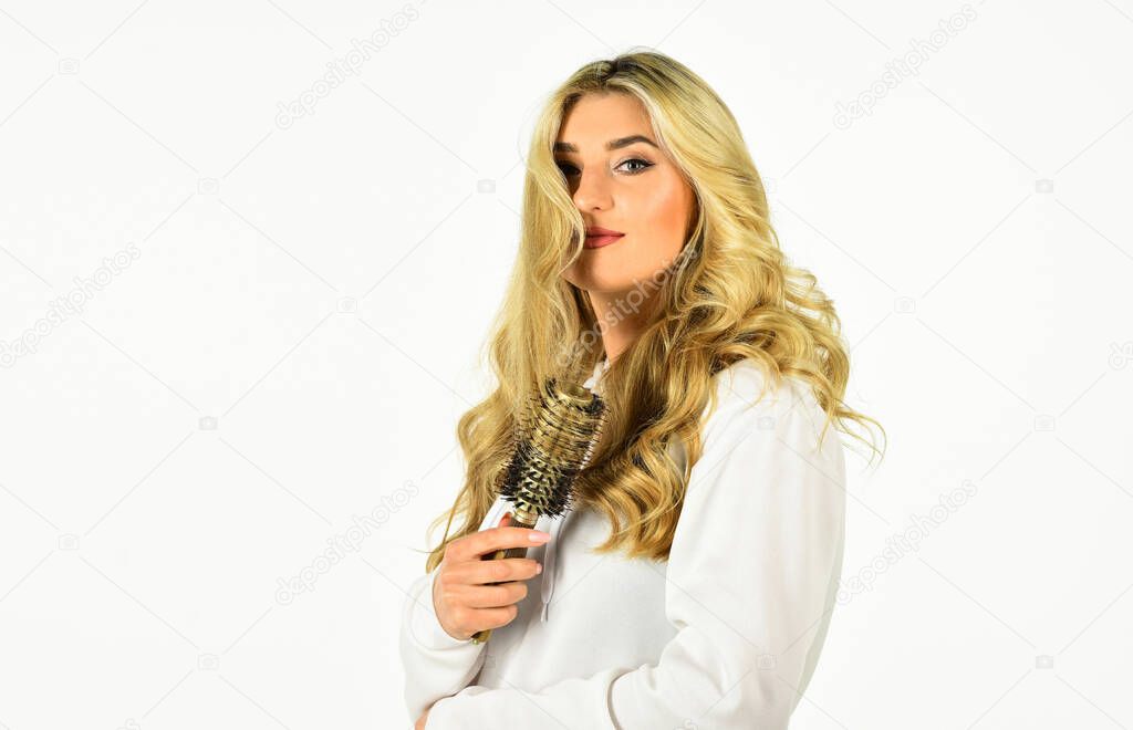 Professional equipment. Easy hairdo. Beauty supplies. Bristles perfectly untangle curly hair. Hot curling brush. Pretty woman brushing hair isolated on white. Long hair. Hair care. Hairdresser salon