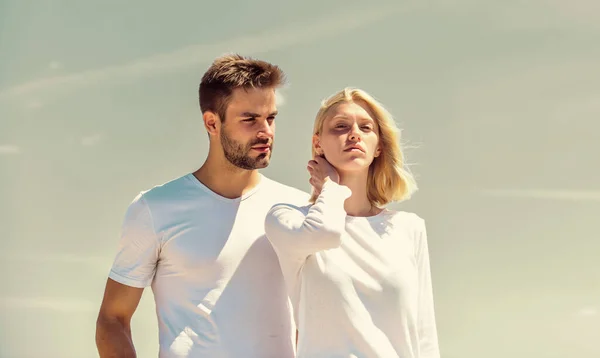 Love story. Romantic relations. Couple in love blue sky background. Man and woman white clothes sunny day outdoors. True love. Communication problems. Summer romance. Family love. Devotion and trust