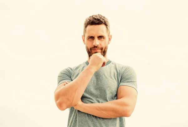 Thoughtful man isolated on white. sportsman with athletic body. coach in fitness gym. after workout. man athlete in blue sport tshirt. sportswear fashion. muscular male with beard. serious man — Stock Photo, Image