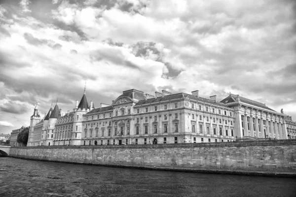 Place of interest. Palace at embankment. Palace building river view. Old palace in paris france. Palace residence on cloudy sky. Architecture and structure. Historical monument. Travel destination — Stock Photo, Image