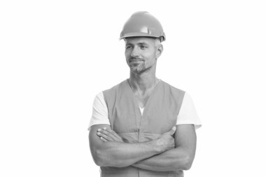 Bina tasarımı. Tasarım mimarı. Geleceği tasarla. Kasklı olgun bir adam. İnşaat alanında çalışıyor. Koruyucu yelek ve kask giyen bir inşaatçı. İnşaat işçisi beyazı izole etti. Daha iyi bir yaşam için mühendislik.
