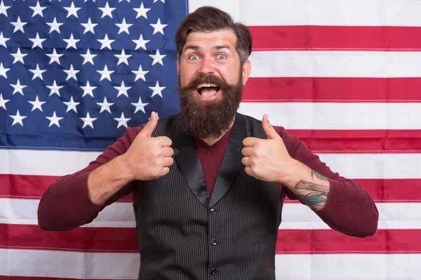 His best trip. american citizen show thumb up at usa flag. american citizen in election. happy celebration of victory. bearded hipster man being patriotic for usa. american education reform in july 4 — Stock Photo, Image