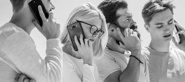 Surround yourself. business communication. men and girl speak on phone. diverse young people talking on phone. group of four people. Corporate team group. group of people. User group network — Stock Photo, Image
