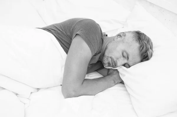 Relaxed man. Promote prevention and management of sleep disorders. World Sleep Day. Benefits of good and healthy sleep. Breathe Easily, Sleep Well. Handsome man in bed. Sleeping guy at home — Stock Photo, Image