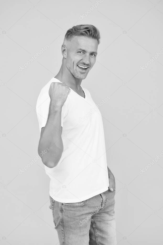 Mens power. Happy man fix arm yellow background. Bachelor show muscle power. Casual style and fashion trends. Powerful and confident. Confidence is power