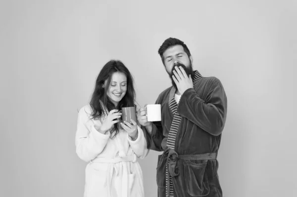 Drinking coffee. Brewing coffee at home. Hot drink. Together more tasty. Coffee is our tradition. Man and woman happy together. Family traditions. Couple in cozy bathrobes enjoy lazy weekend — Stock Photo, Image