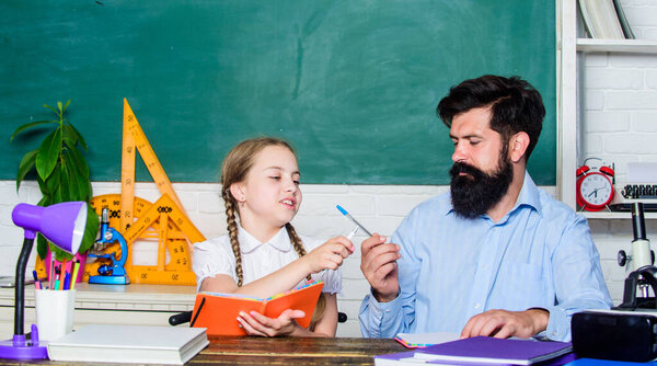 education child development. back to school. bearded man teacher with small girl in classroom. knowledge day. Home schooling. daughter study with father. Teachers day. Childhood memories
