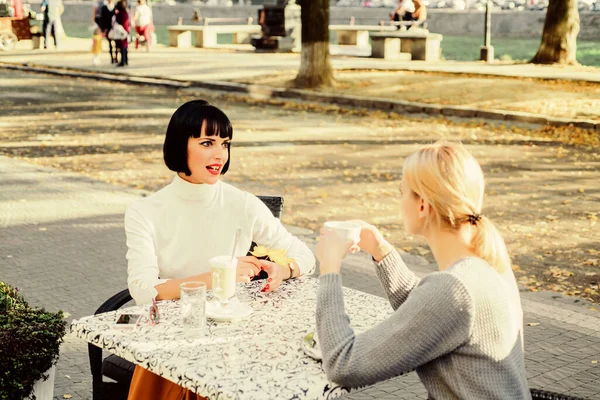 Conversation of two women cafe terrace. Friendship meeting. Sharing thoughts. Female friendship. True friendship friendly close relations. Trustful communication. Girls friends drink coffee and talk — Stock Photo, Image