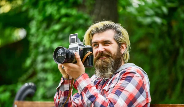 Professional photographer use vintage camera. bearded man hipster take photo. photo shooting outdoor. brutal man traveler with retro camera. photography in modern life. travel tips — Stock Photo, Image