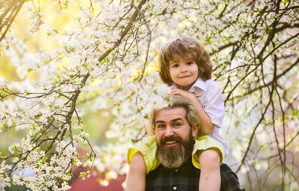 Fathers day. Child having fun with dad. Happy family. Little boy and father in nature background. Springtime. Hipster piggybacking baby. Bearded brutal man good father. Dad and son. Best dad ever — Stock Photo, Image