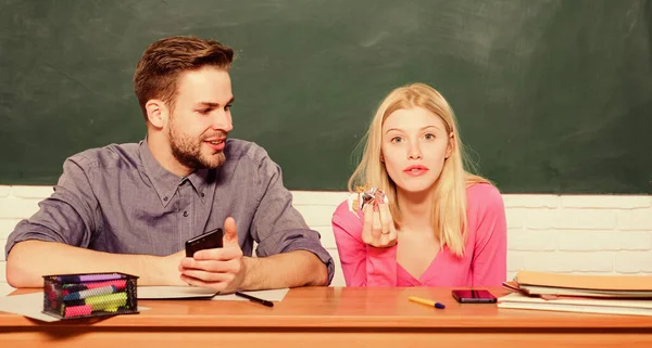 Studying in college or university. Friends students studying university. College fun. Modern education. Having fun in college. Guy and girl carefree sit at desk in classroom. Enjoying time in college — Stock Photo, Image