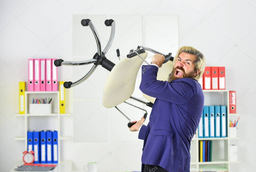 Get out of my office. Drive out uninvited guest. Stress concept. Crazy or mad. Businessman standing in office hold chair. Business man aggressive. Hipster man angry with office chair. Throw out chair