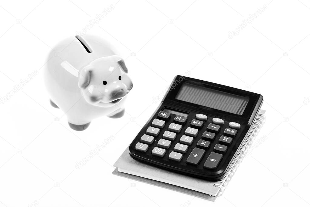 Piggy bank pink pig and calculator. Exchange rates. Economics and business administration. Credit debt concept. Piggy bank money savings. Economics and profit management. Economics and finance