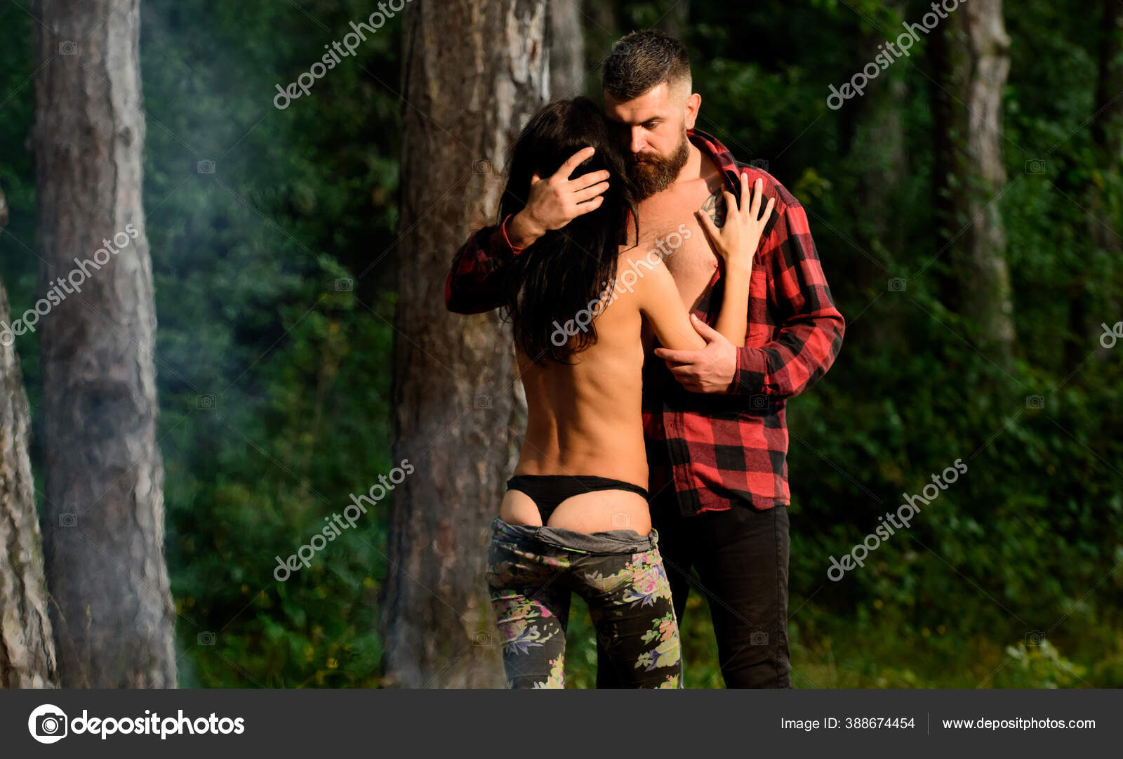 Couple in love have sex outdoor, trees on background, Stock Photo by ©stetsik 388674454