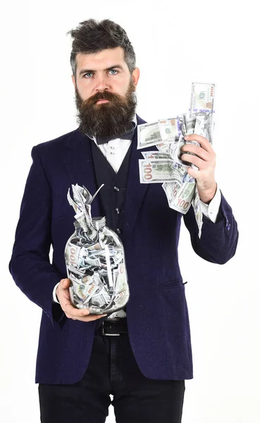 Man in suit, businessman with jar full of cash, banknotes — Stock Photo, Image