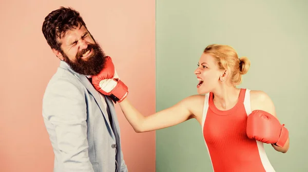 Some call them opponents. knockout punching. who is right. win the fight. Strength and power. family couple boxing gloves. problems in relationship. sport. bearded man hipster fighting with woman