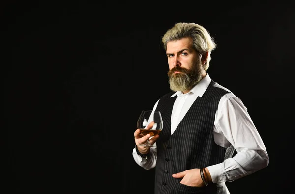 Matured in sherry casks. Whisky tasting. Good indication of condition of whisky. Bearded businessman in elegant suit with glass of whisky. Sommelier tastes expensive drink. Elegant macho drink cognac — Stock Photo, Image