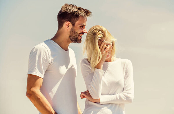 Love story. Man and woman white clothes sunny day outdoors. Communication problems. Summer romance. Family love. True love. Romantic relations. Couple in love blue sky background. Devotion and trust
