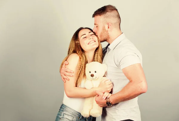 Life together. valentines day present. sexy girl and man hold teddy bear. romantic relationship. love date. family values. couple in love. family relations and happiness. man and woman embrace — Stock Photo, Image