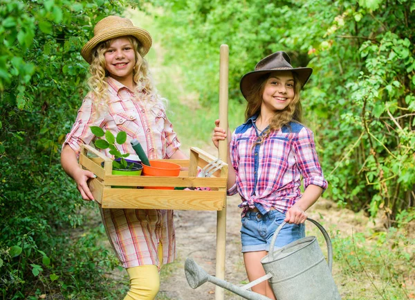 Gardening basics. Kids girls with tools for gardening. Gardens great place cultivate meaningful and fun learning experience for children. Gardening teaching life cycle process. Summer at countryside — Stock Photo, Image