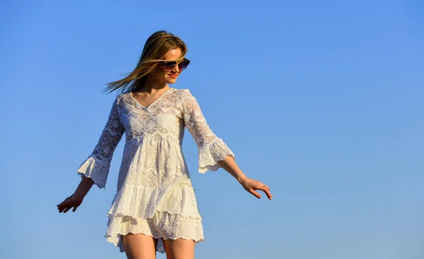 Carefree girl. Freedom. Impulsiveness and ease. Naturalness concept. Dancing woman. Mental health. Girl blue sky background. Emotional girl. Happy girl white dress feel free. Summer party. Sunny day — Stock Photo, Image