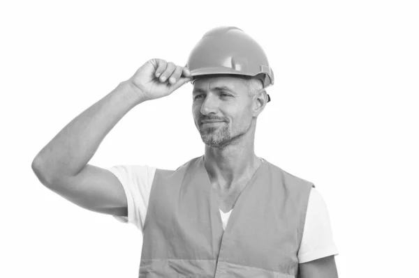 Alles is onder controle. Veiligheidsconcept. De man draagt een beschermende helm en uniform. Vrolijke bouwer. Het concept van beschermende uitrusting. Knappe bouwer. Inspecteur controle. Architectencontrole — Stockfoto