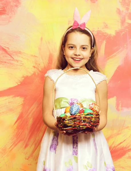 Small happy baby girl holding pottle with easter eggs — Stock Photo, Image