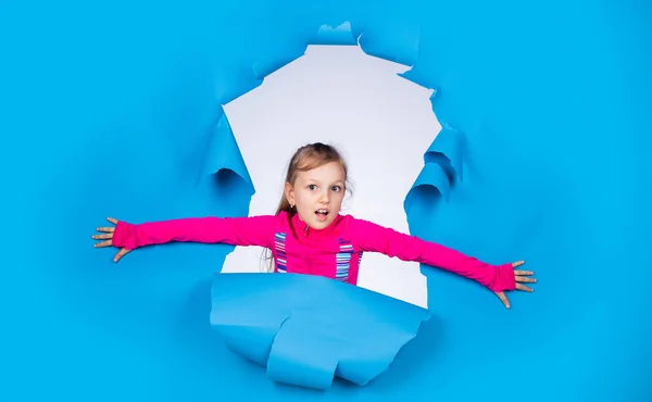 Following her personal style. kid with cheerful emotions. female hairdresser salon. beauty and fashion. happy child has casual look. trendy kid has happy childhood. small girl on blue background