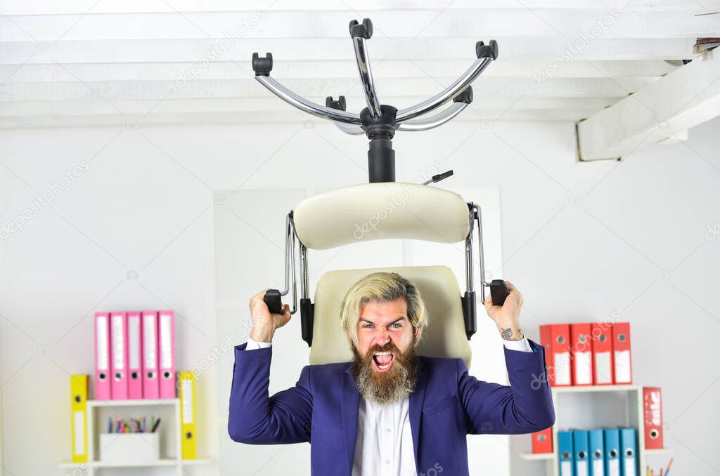 Throw out chair. Businessman standing in office hold chair. Business man aggressive. Hipster man angry with office chair. Get out of my office. Drive out uninvited guest. Stress concept. Crazy or mad