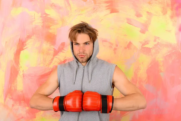 Man with messy hair on colorful background. Guy in hoodie — Stock Photo, Image