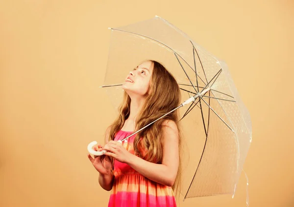 Invisible protection. Fall season. Enjoy rain concept. Love rainy days. Kid girl happy hold transparent umbrella. Enjoy rainy weather. Waterproof accessory. Weather forecast. Rainy days coming