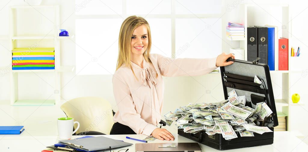 Smart blonde earn lot of money. Financial success. Tax service. Financial expert. Girl with briefcase full of cash. Financial achievement. Money laundering. Business challenge. Accounting and banking