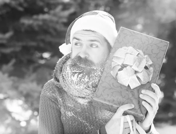 Handsome santa man with gift — Stock Photo, Image