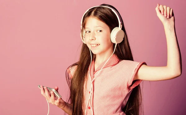 Dancing. girl listen to music. Audio book. back to school. child study online. E learning with ebook. home schooling. small girl pupil in headphones. self education. Mp3 player — Stock Photo, Image