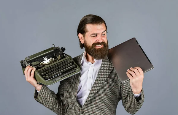 happy smile. successful businessman use retro typewriter and computer. mature man hold vintage device. first draft. professional typist make notes typing. modern and old technology. digital business