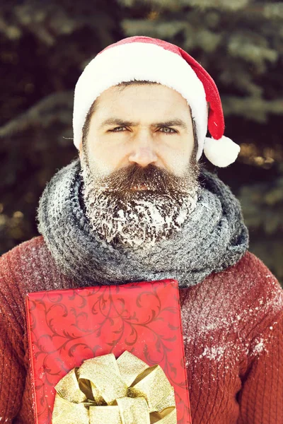 Handsome santa man with gift — Stock Photo, Image