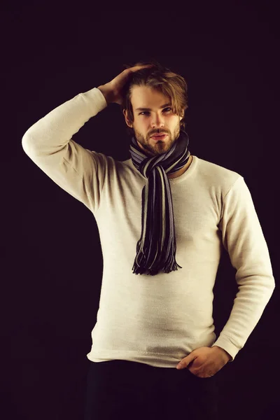 Bearded macho with striped scarf looking confidently — Stock Photo, Image