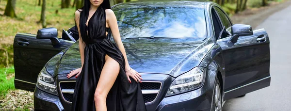 Seductive pose. Sex in car. Driver girl. Beauty and fashion. Woman in black dress escort service worker. Sexy girl elegant dress and auto. Provocative concept. Luxury car. Escort and sexual services — Stock Photo, Image