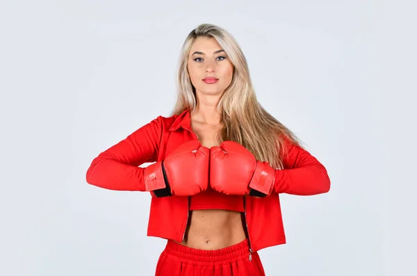 Self improvement. Sporty girl red clothes boxing gloves. Gym and workout. Fitness model. Sporty lifestyle. Sporty woman fitness trainer. Overcome problems. Personal training. Fight with own complex Stock Photo