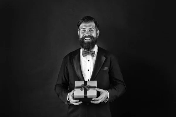 Celebrate holiday with perfect present. Happy businessman with present. Bearded man hold present box. Shopping for present. Gift shop. Celebration and preparation. Souvenir. Joy of giving