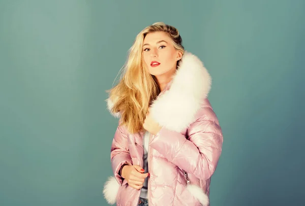 Winter clothes. Down jacket with furry hood. Girl wear winter jacket. Winter season. Soft fur. For those wishing stay modern. Fashion environmental awareness. Faux fur is more than just trend