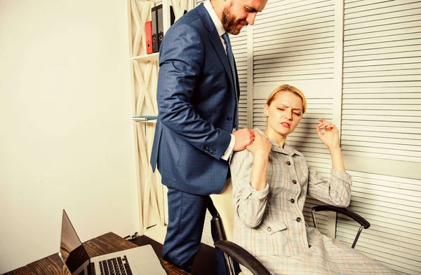 Flirtation or sexual harassment recognize and report. Identifying harassment. Create greater safety and trust. Sexual harassment at work. Man and woman colleagues flirt in office. Recognize pursuer — Stock Photo, Image