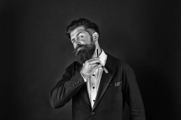 Good beard needs good barber. Bearded man hold beard grooming tool. Businessman shave beard with razor. Beard shaving and styling. Facial hair. Barbering. Barbershop — Stock Photo, Image